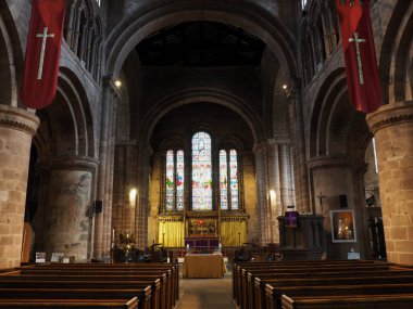 Chester. Cheshire, United Kingdom - 20 March 2024 : The nave, chancel and stained glass windows in St John the Baptist's Church, Chester clipart
