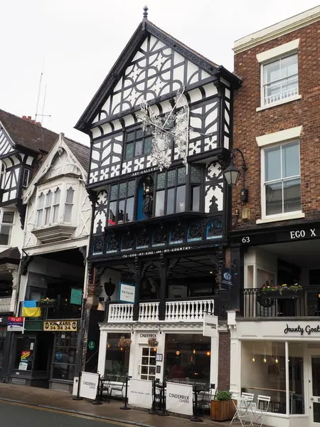 stock image Chester, Cheshire, United Kingdom - 20 March 2024 : Old half timbered building with cinderbox cafe in Bridge street Chester