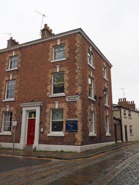 Chester. Cheshire, United Kingdom - 20 March 2024 : The corner of Grosvenor place in Chester with guest house building clipart