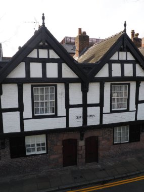 Chester. Cheshire, United Kingdom - 20 March 2024 : parish boundary markers on old almshouses in Park street Chester marking the boundary between St Oswald Parish