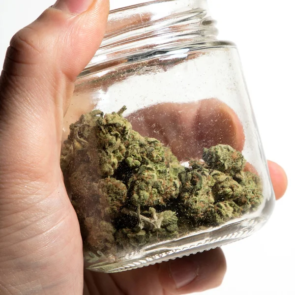 Menselijke Hand Glazen Pot Met Cannabis — Stockfoto