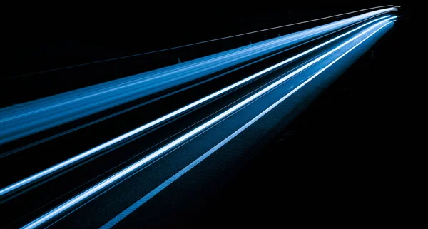 stock image blue car lights at night. long exposure