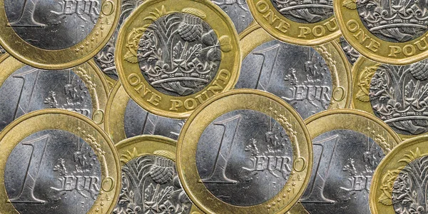 one pound and one euro coins. background