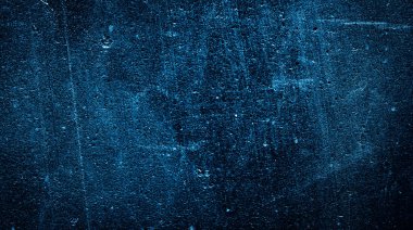 İlginç bir deseni olan mavi boyayla boyanmış duvar.