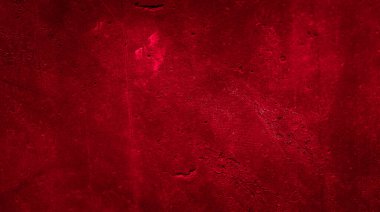 İlginç bir deseni olan kırmızı boyayla boyanmış duvar.