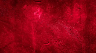 İlginç bir deseni olan kırmızı boyayla boyanmış duvar.