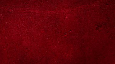 İlginç bir deseni olan kırmızı boyayla boyanmış duvar.