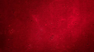 İlginç bir deseni olan kırmızı boyayla boyanmış duvar.