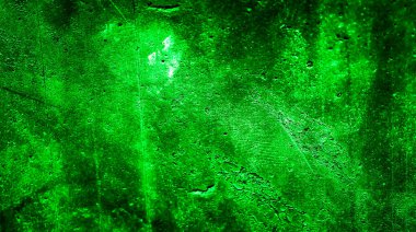 İlginç desenli yeşil boyayla boyanmış bir duvar.