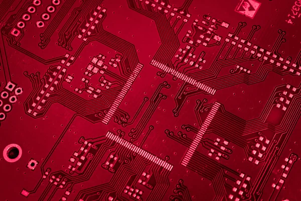 stock image red printed circuit board with gold plating