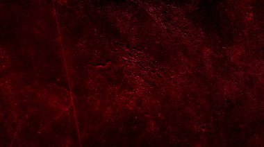 İlginç bir deseni olan kırmızı boyayla boyanmış duvar.