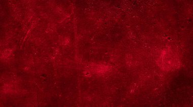 İlginç bir deseni olan kırmızı boyayla boyanmış duvar.