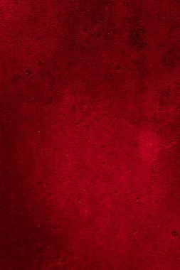 İlginç bir deseni olan kırmızı boyayla boyanmış duvar.