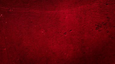 İlginç bir deseni olan kırmızı boyayla boyanmış duvar.