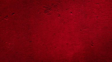 İlginç bir deseni olan kırmızı boyayla boyanmış duvar.