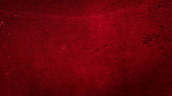 wall painted with red paint with an interesting texture