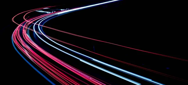 stock image lights of cars driving at night. long exposure