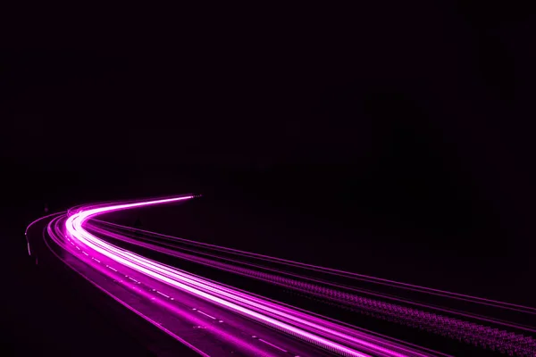 stock image violet car lights at night. long exposure