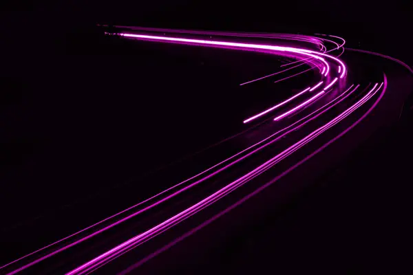 stock image violet car lights at night. long exposure