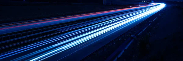 stock image lights of cars driving at night. long exposure