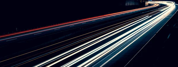 stock image lights of cars driving at night. long exposure