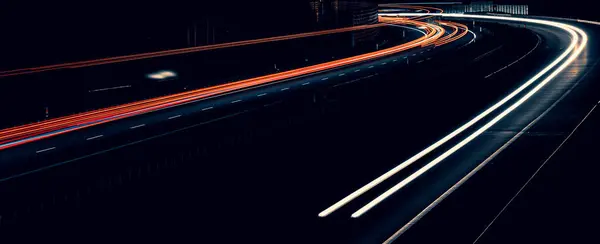 stock image lights of cars driving at night. long exposure