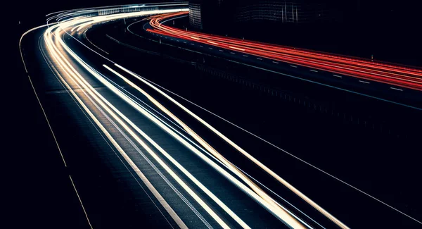 stock image lights of cars driving at night. long exposure