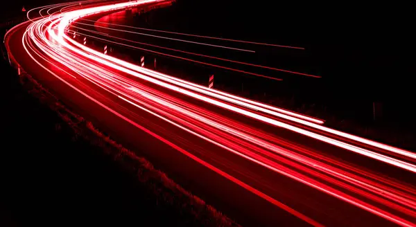 stock image lights of cars driving at night. long exposure