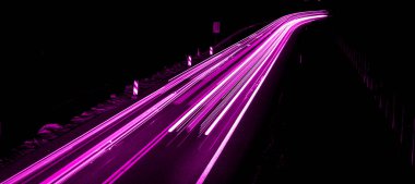 violet car lights at night. long exposure clipart