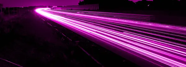 stock image violet car lights at night. long exposure