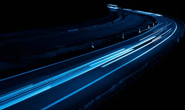 stock image blue car lights at night. long exposure