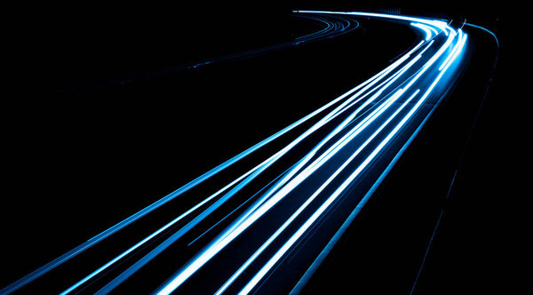 Blue car lights at night. long exposure