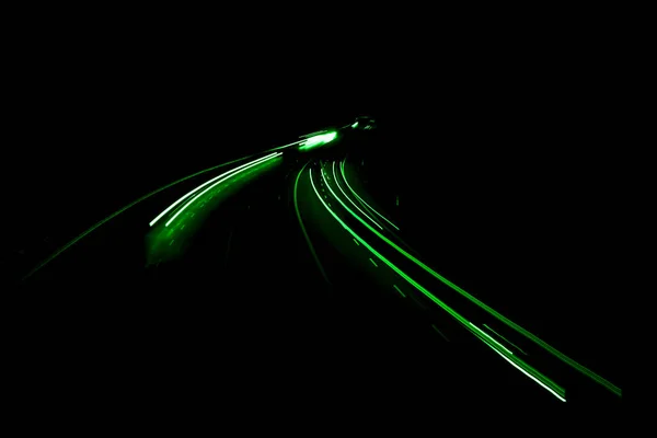 stock image green car lights at night. long exposure