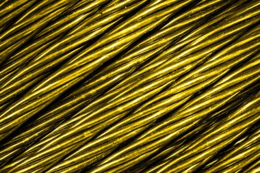 Altın alüminyum elektrik kablosu. Arka plan veya doku