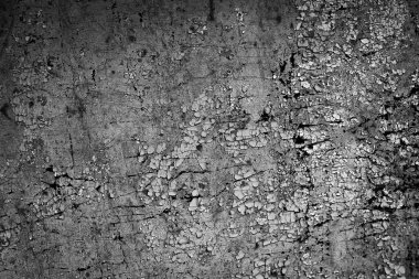 Beyaz eski soyan boyayla boyanmış siyah bir duvar.