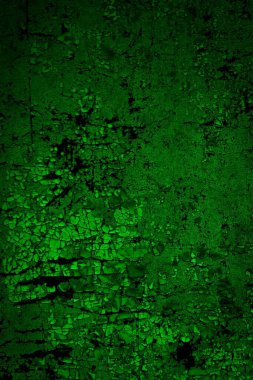 Beyaz, eski, soyulmuş boyayla boyanmış yeşil duvar.