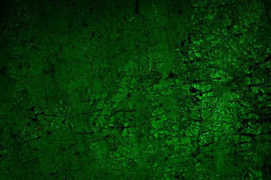 Beyaz, eski, soyulmuş boyayla boyanmış yeşil duvar.