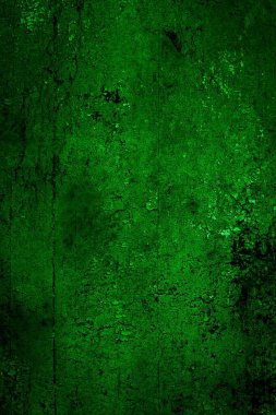 Beyaz, eski, soyulmuş boyayla boyanmış yeşil duvar.