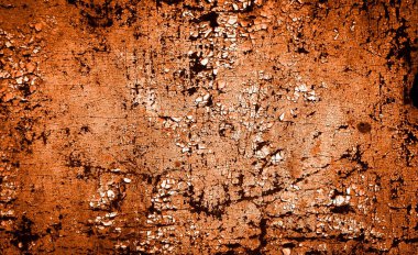 turuncu duvar beyaz eski soyulmuş boyayla boyanmış.