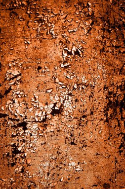 turuncu duvar beyaz eski soyulmuş boyayla boyanmış.