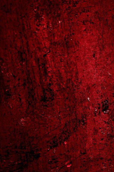 red wall painted with white old peeling paint