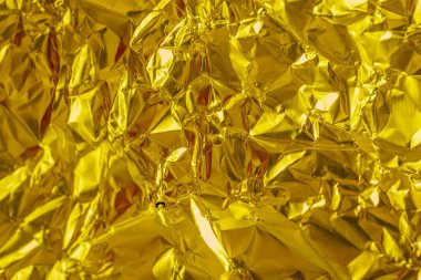 Buruşmuş altın levha metal. arkaplan veya doku