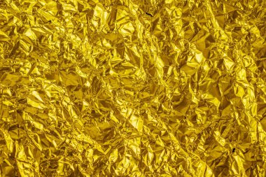 Buruşmuş altın levha metal. arkaplan veya doku