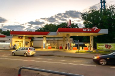 Ustka, Poland - 25.06.2024 - Orlen petrol station at sunset in Ustka clipart