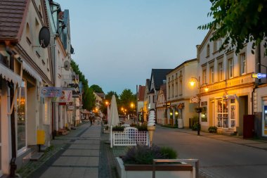 Ustka, Poland - June 25, 2024 - people on the streets in Ustka clipart