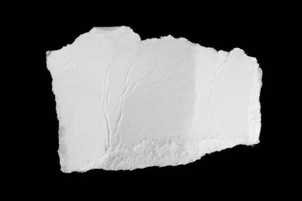 a white piece of paper on a black isolated background