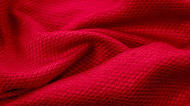 İlginç desenli kırmızı pamuk kumaş.