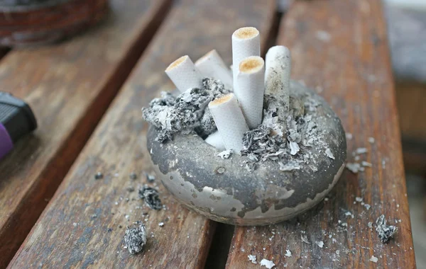 stock image The ashtray is full of cigarette butts. 