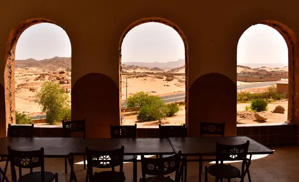 Desert scene seen through arched windows, Djanet, Algeria