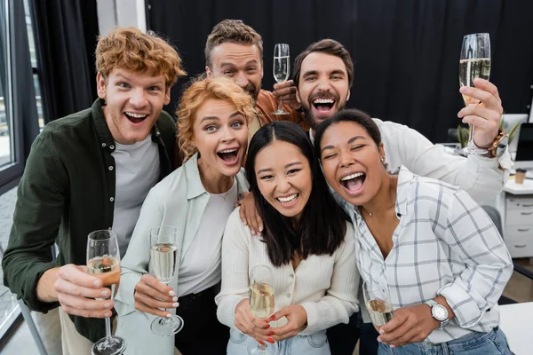 Cheerful Interracial Business People Holding Glasses Champagne Looking Camera Office — Stock Photo, Image